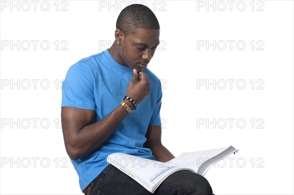 Black man reading book