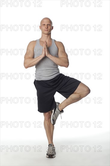 Caucasian man practicing yoga