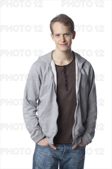 Smiling Caucasian man with hands in pockets