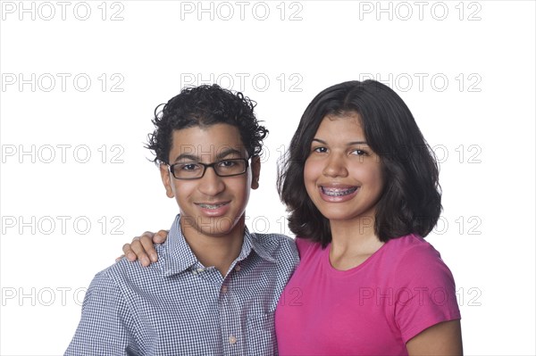 Smiling Hispanic brother and sister