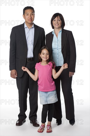 "Smiling mother, father and daughter"