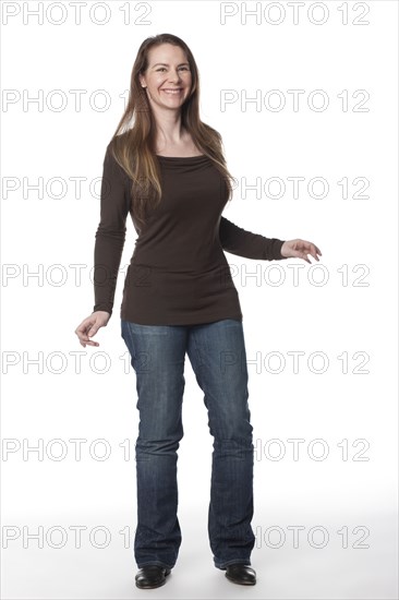 Smiling Caucasian woman with arms outstretched