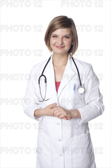 Smiling Caucasian doctor with hands clasped