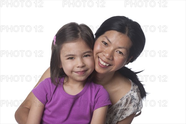 Smiling mother and daughter