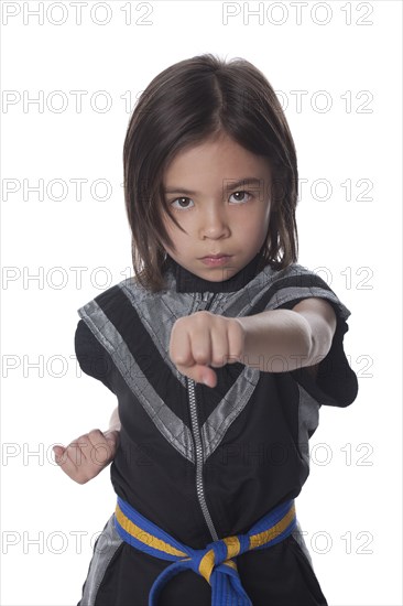 Mixed race girl in ninja outfit