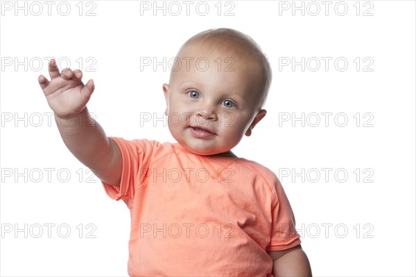 Smiling Caucasian baby boy with arms outstretched