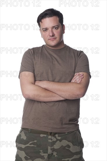 Serious Caucasian man with arms crossed