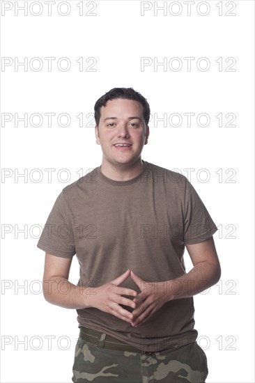 Caucasian man with hands clasped