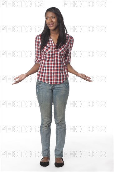 Smiling mixed race woman with arms outstretched