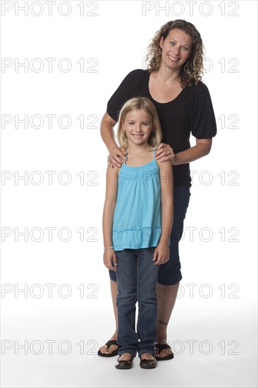 Smiling Caucasian mother and daughter