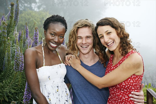 Friends smiling together outdoors