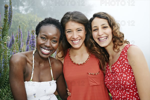 Women smiling together outdoors