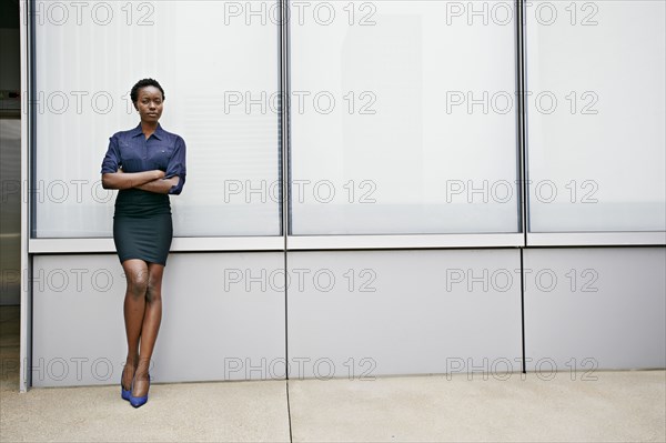 African American businesswoman standing on city street