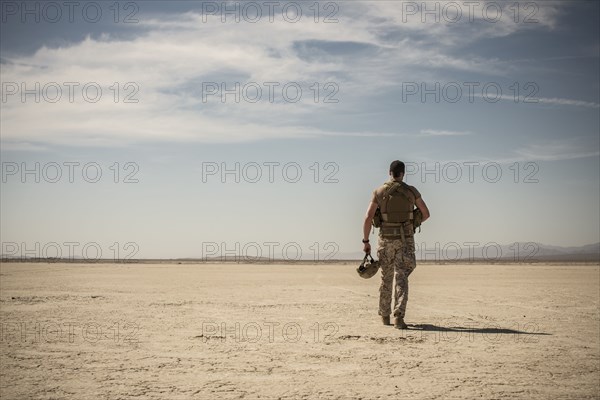 Soldier walking in remote desert