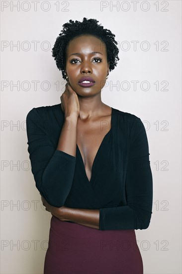 Black woman standing with arms crossed