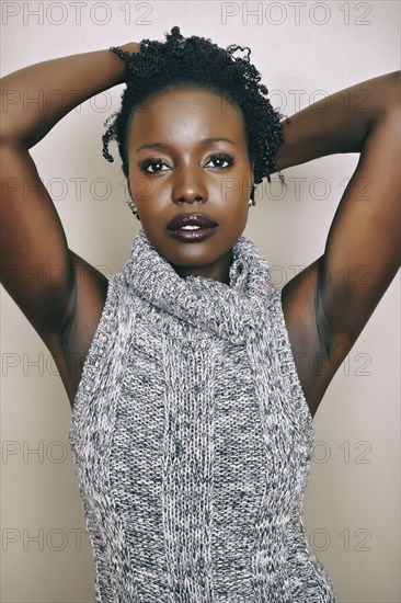Black woman wearing knitted turtleneck