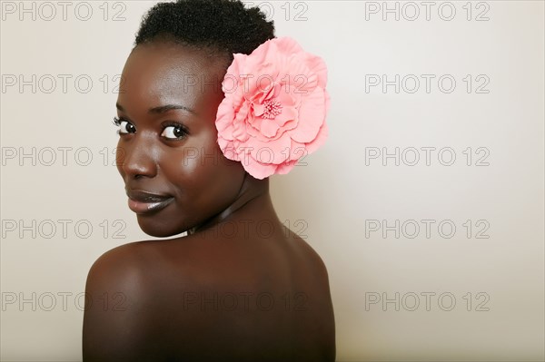 African American woman wearing flower in hair