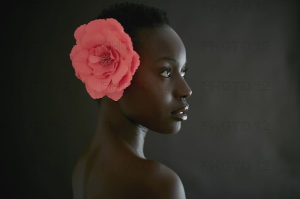 African American woman wearing flower in hair