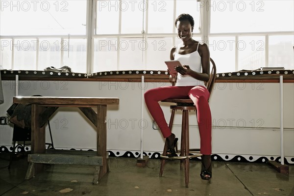 Black woman using digital tablet