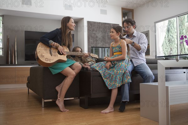 Family relaxing together in living room