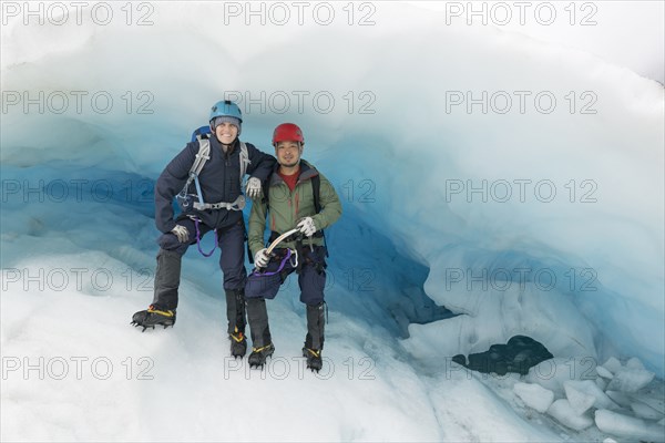Portrait of couple standing on glacier