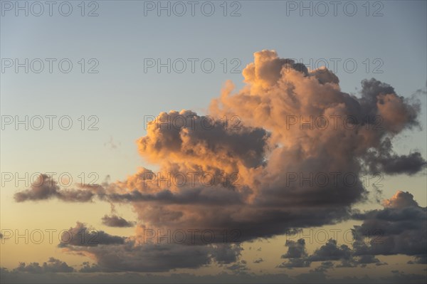 Cumulus cloud formation against sky at sunrise