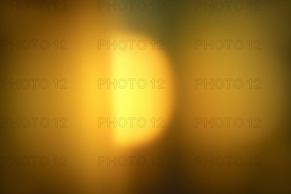 Yellow blurred abstract pattern of light with sun