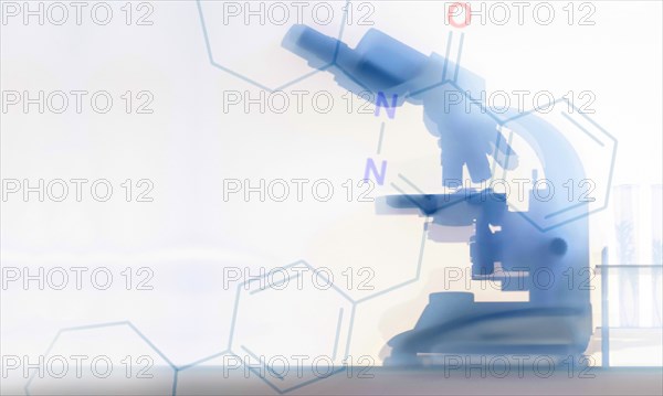 Silhouette of microscope and chemistry symbols