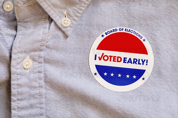 Close-up of voting sticker on shirt