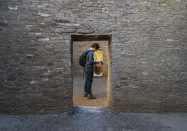 Female tourist reading guidebook