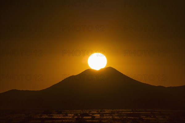 Sun setting above hill in Cerrillos Hills State Park