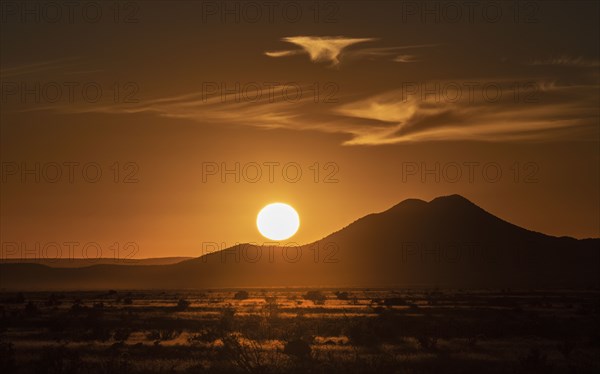 Sun setting above hill in Cerrillos Hills State Park