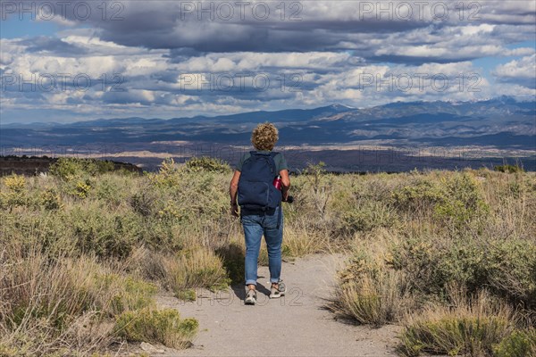 Rear view of woman hiking