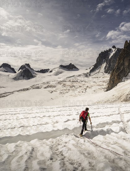 Rear view of climber on glacier