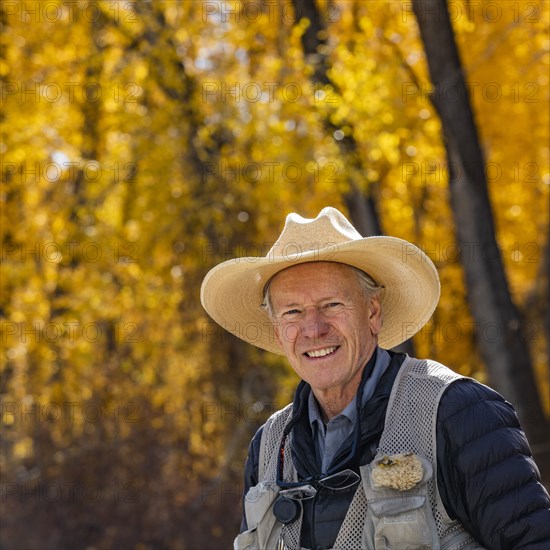 Portrait of smiling senior fisherman