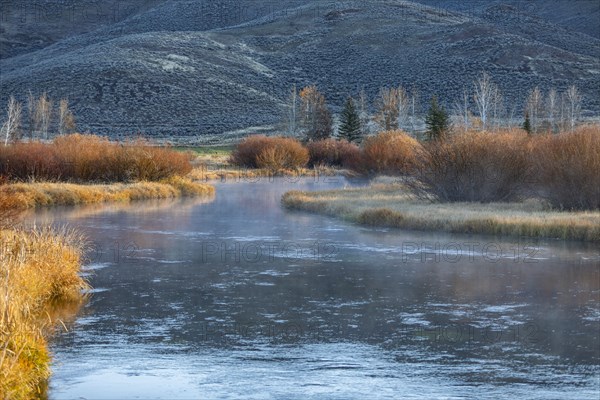 Spring creek in fall landscape