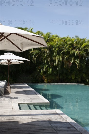 Hotel swimming pool with umbrellas