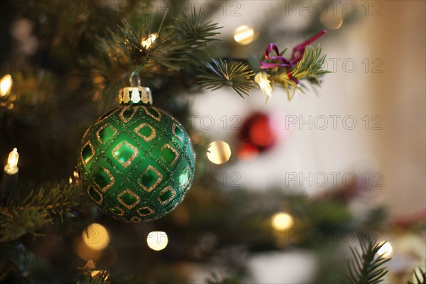 Christmas bauble hanging on tree