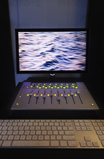 Mixing console and computer in recording studio