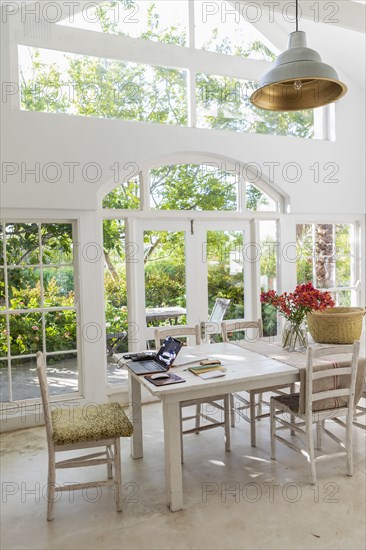 Laptop on table in dining room