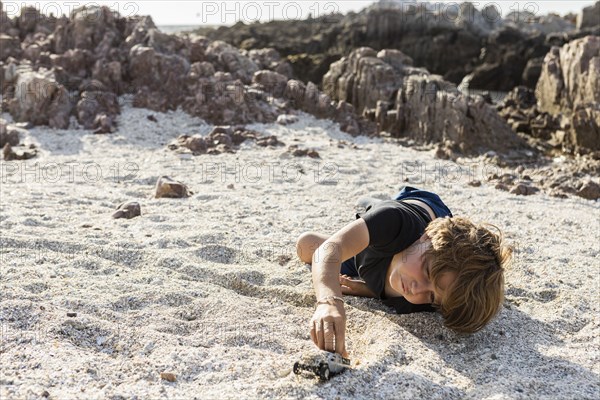 Boy playing on beach