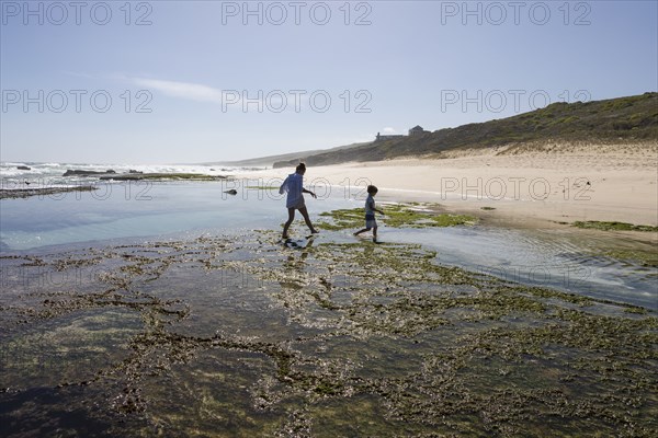 Boy and Girl exploring tidal pools