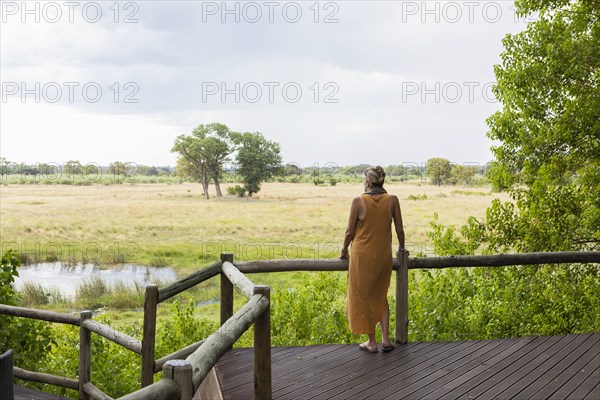 Woman on wooden walkway