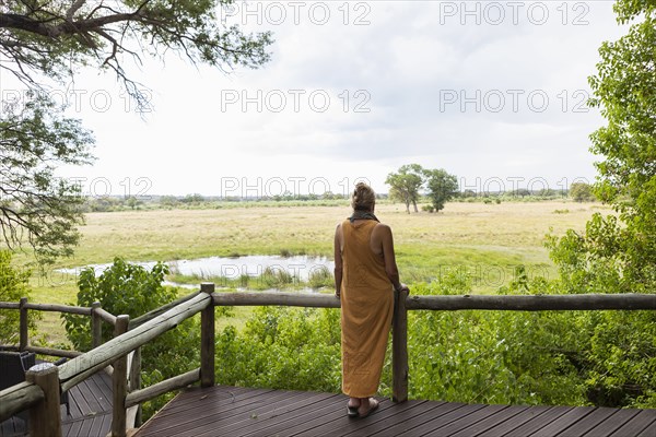 Woman on wooden walkway