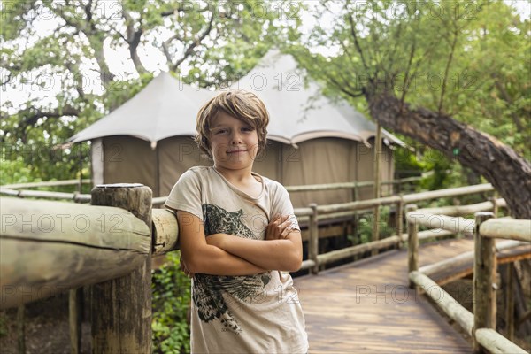 Portrait of Boy on wooden walkway