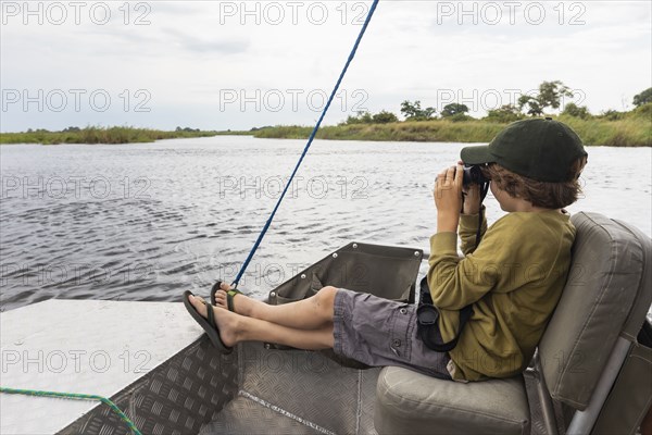 Boy in boat on Zambezi River