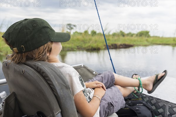 Boy in boat on Zambezi River