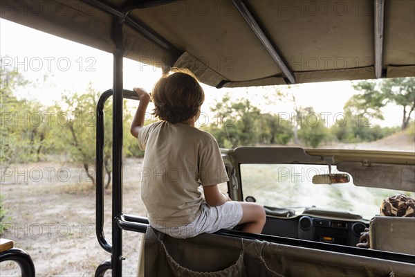 Boy in safari vehicle