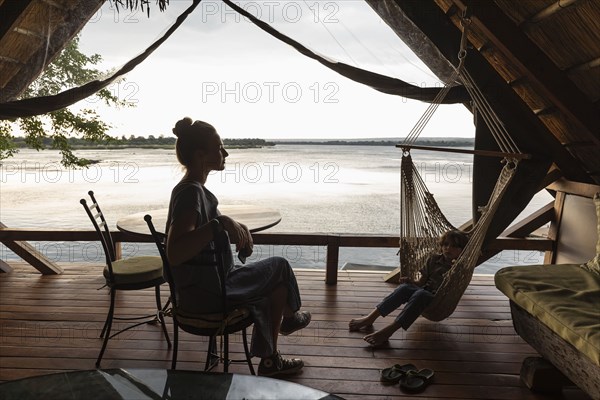 Brother and sister relaxing in lodge