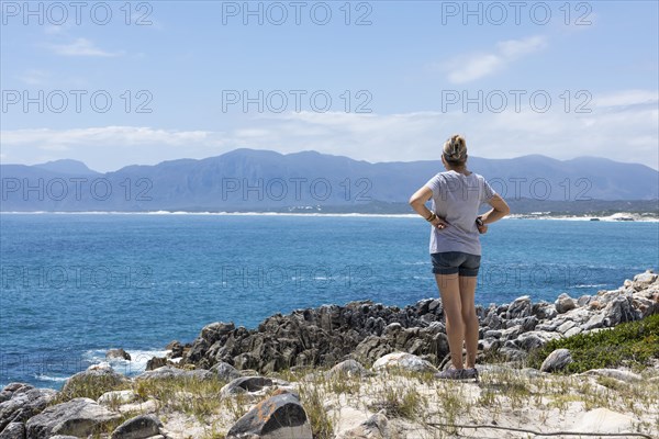 Woman hiking on Atlantic Ocean coast